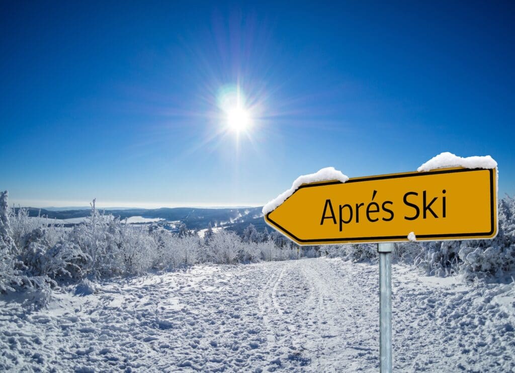 a yellow apres ski sign on a mountain apres ski breckenridge