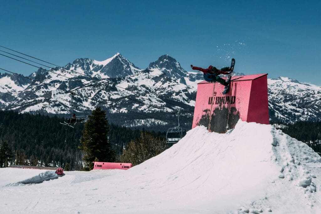 a snowboarder on a half pipe on a terrain park tips for skiing mammoth