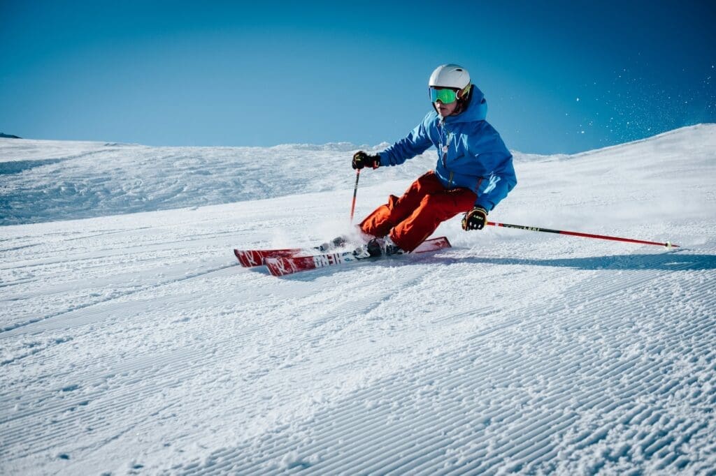 a young person skiing freshly groomed powder