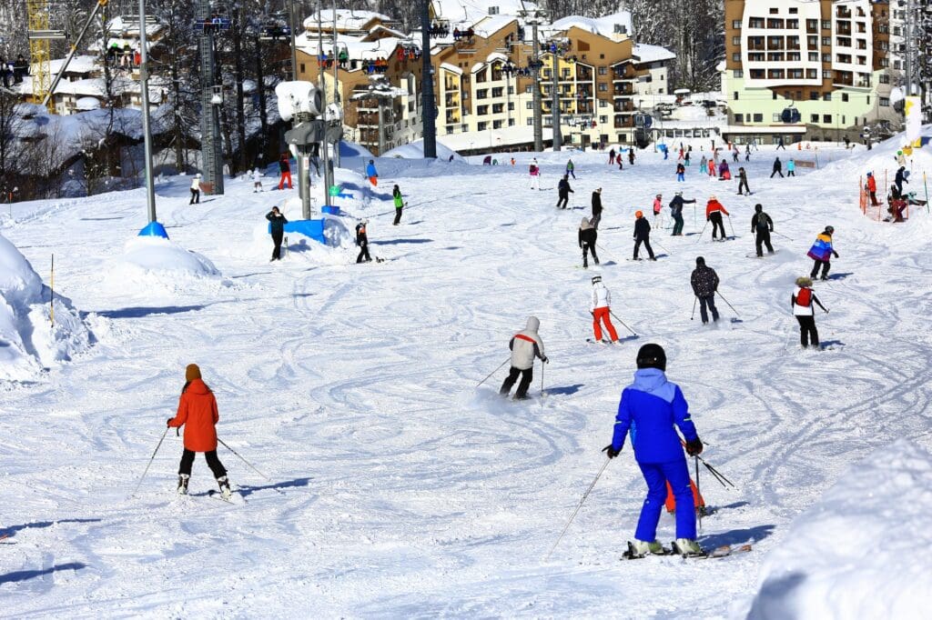 ski slope a lot of skiers background blurred